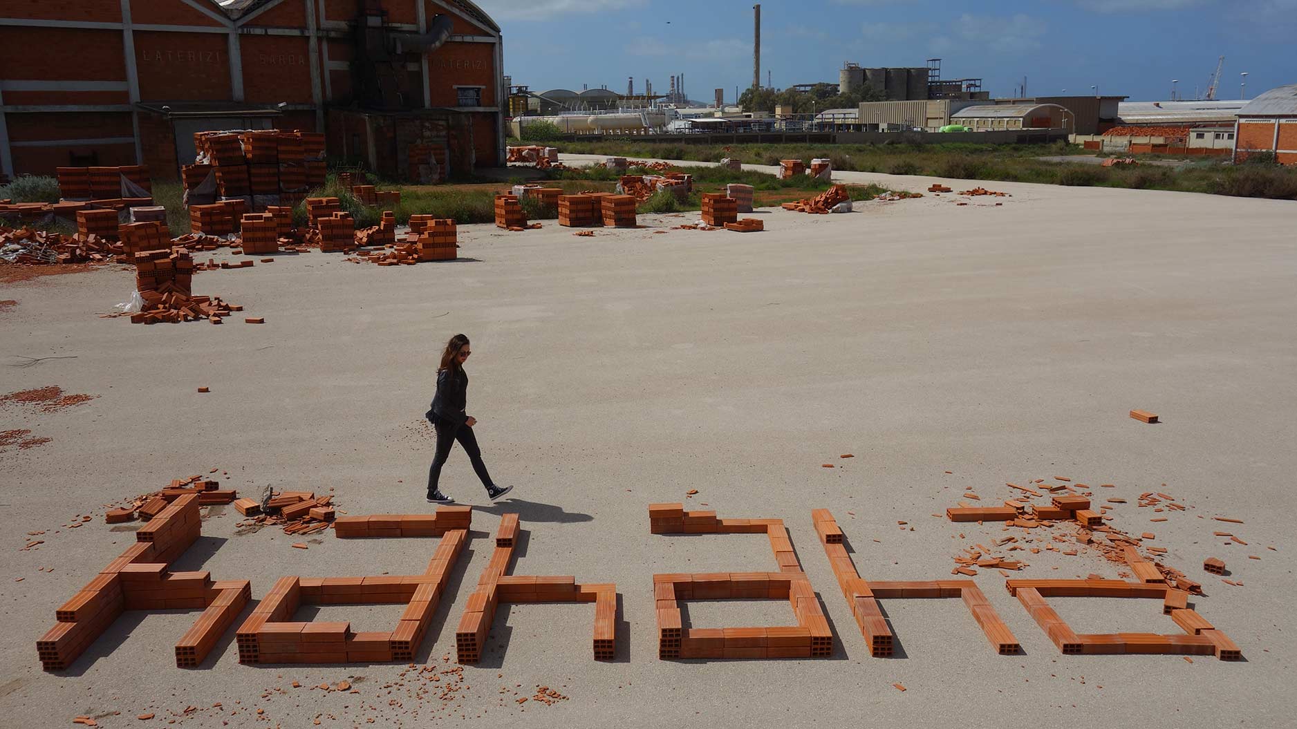'hahaha', 2018. Urban installation made of bricks into an abandoned factory. Sardinia