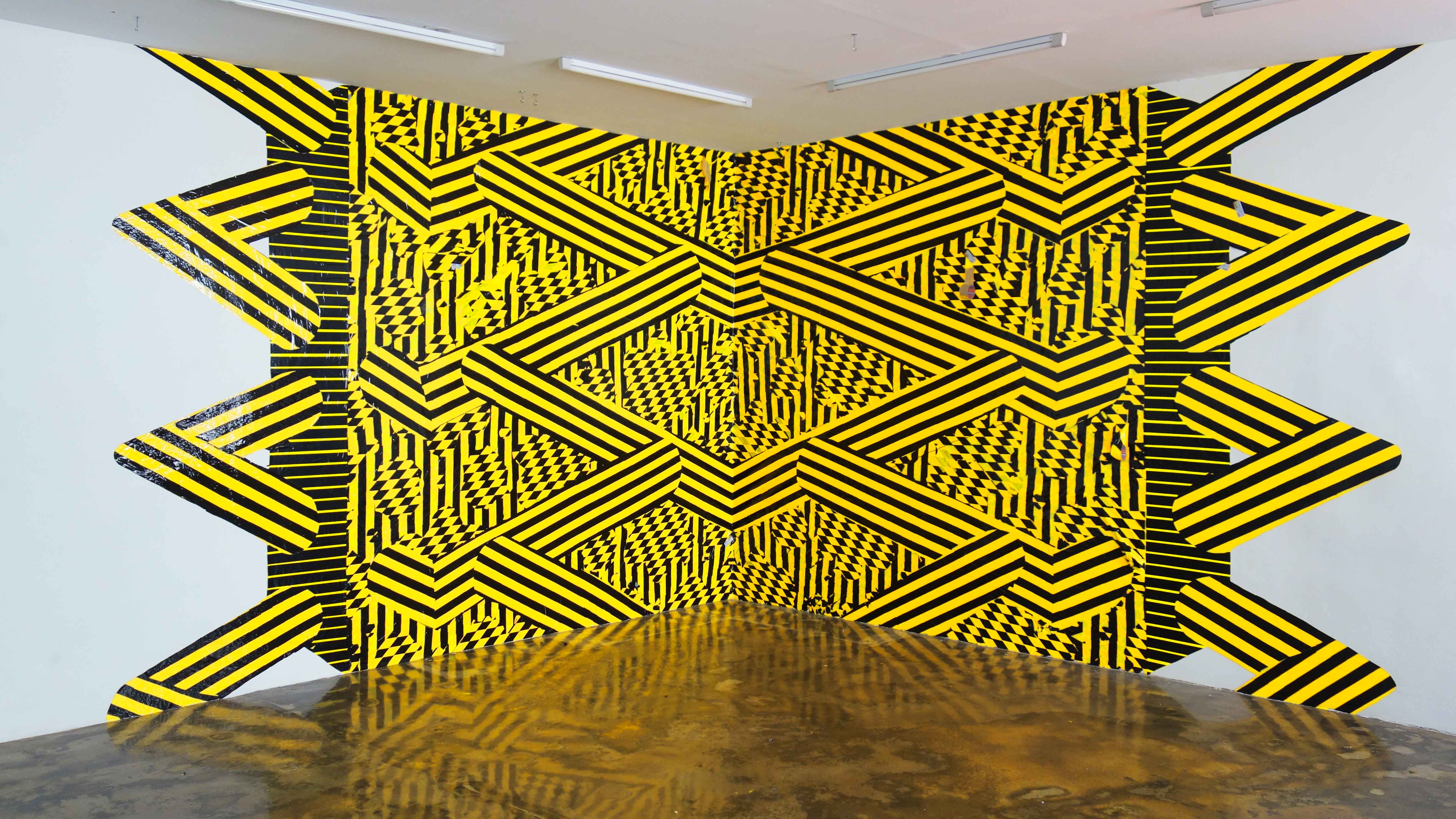 ‘Hipnotic mirage’   series 2019/2015.  Danger tape on wall. Karachi Biennale Karachi / Sehsaal, Wien /Alternate access residency,New York